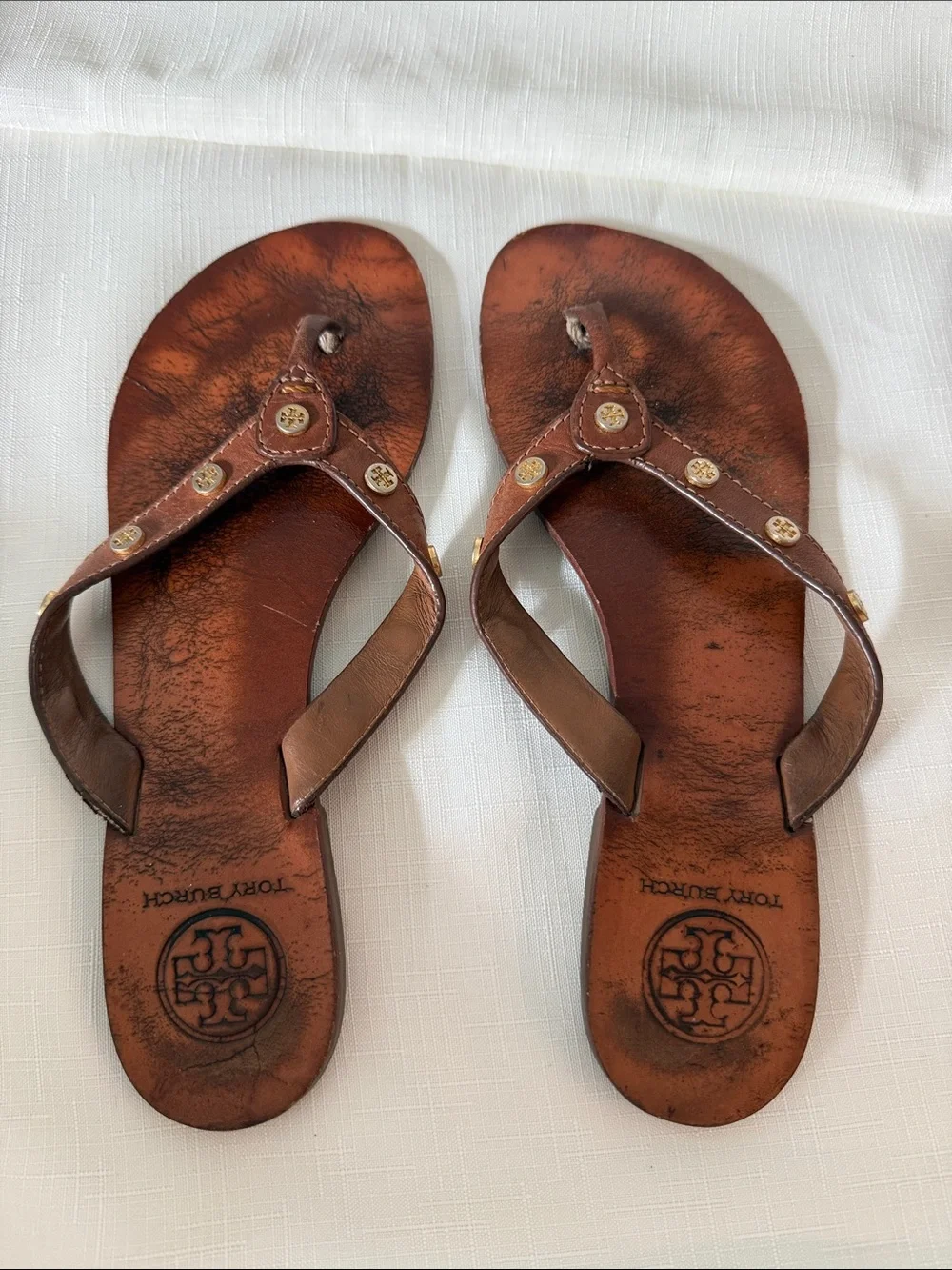 Tory Burch Brown Leather Thong Sandals with Beige Upper and Gold Logo Studs